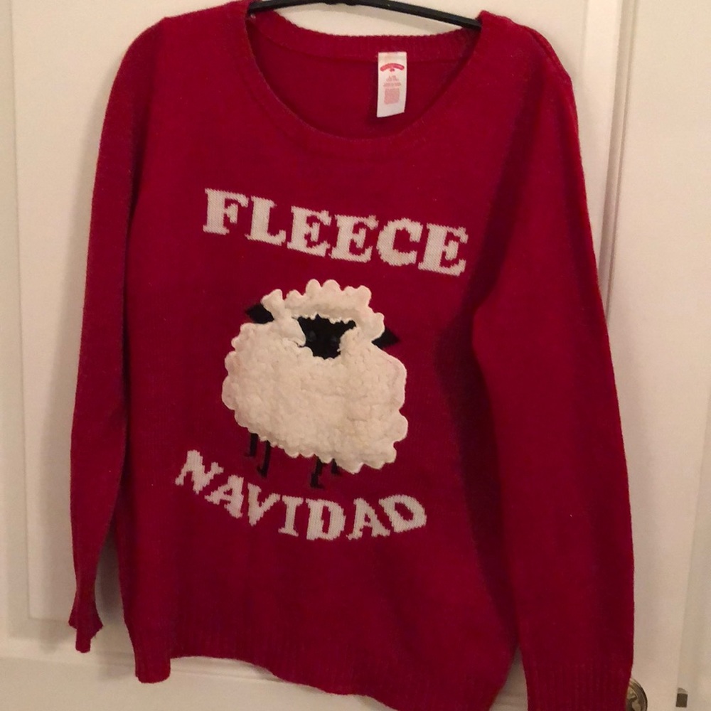 Cute Christmas Sweater with red sparkly fibers.